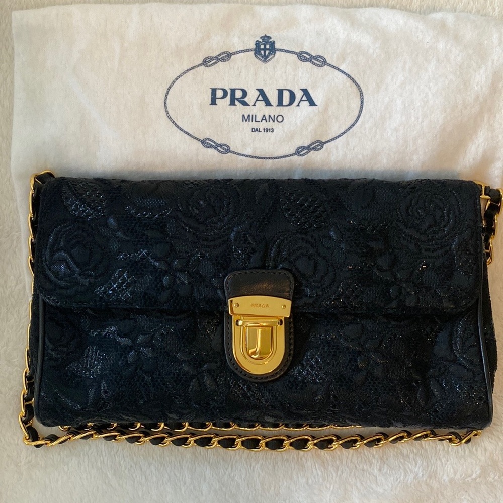Prada leather and embroidery purse with long chain. Can be used crossed body.